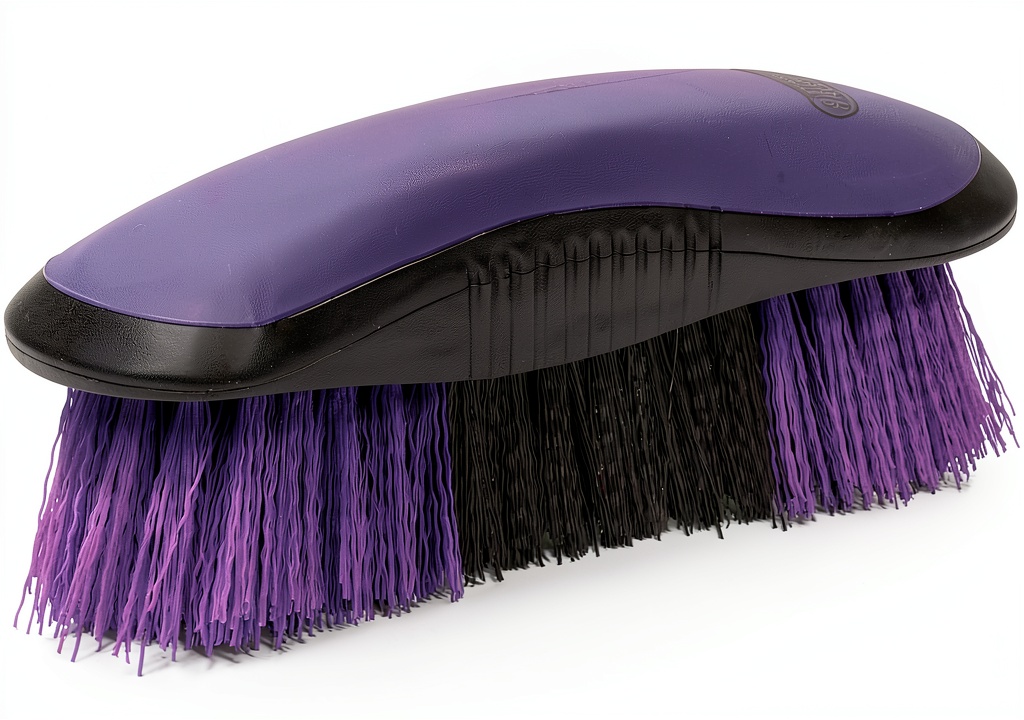 Weaver Leather horse brush in use on a horse's coat